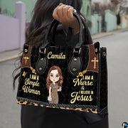 Christian nurse handbag held outdoors showing visual scale against street setting.