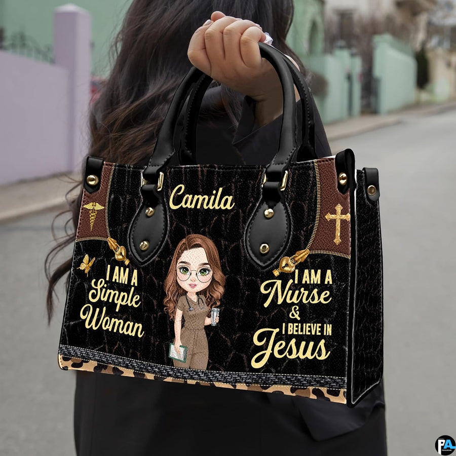 Christian nurse handbag held outdoors showing visual scale against street setting.