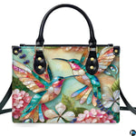 Complete set presentation of turquoise mosaic hummingbird handbag and matching wallet on white backdrop.
