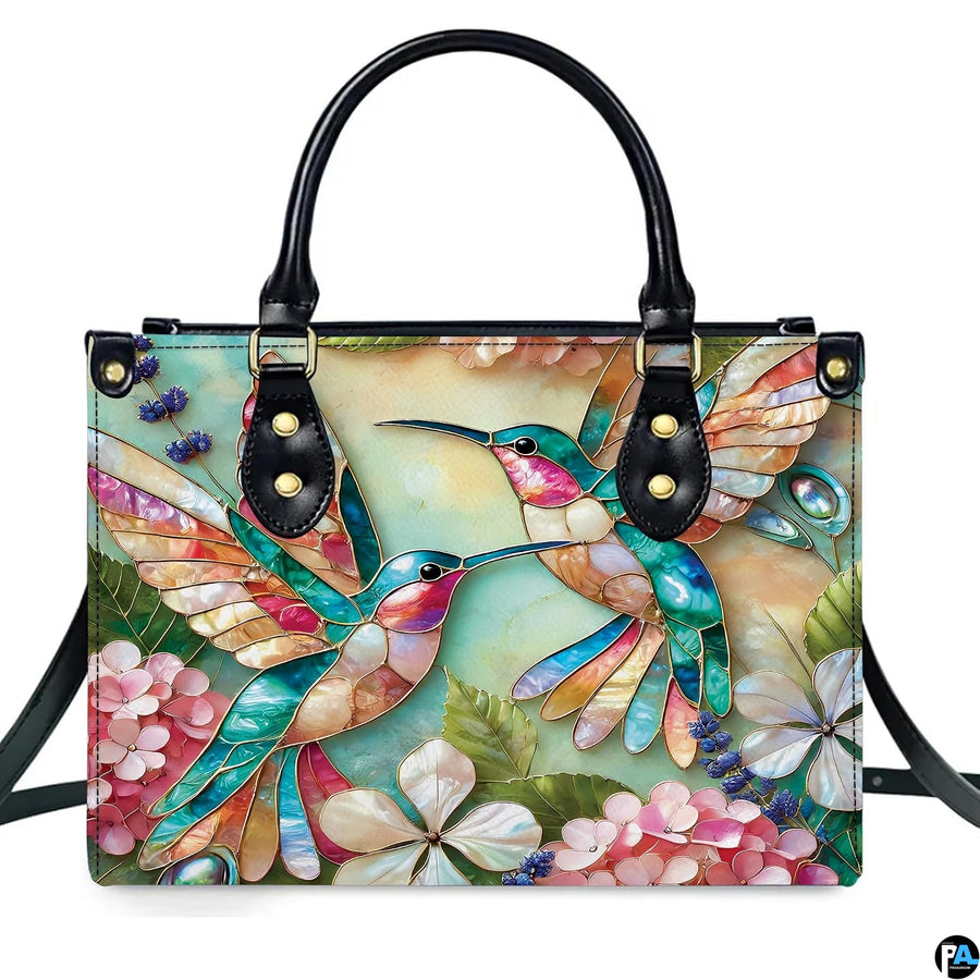 Complete set presentation of turquoise mosaic hummingbird handbag and matching wallet on white backdrop.
