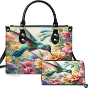 Front view of watercolor hummingbird handbag and matching wallet featuring colorful blooming wildflower art.