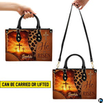 Handheld and shoulder carrying options displayed for the devotional cross handbag.