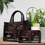 Detailed view of gothic cross handbag showing handle hardware and central rose on the cross.