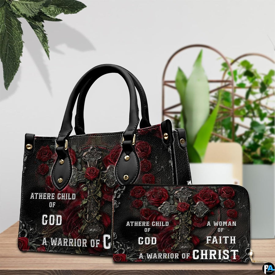 Detailed view of gothic cross handbag showing handle hardware and central rose on the cross.