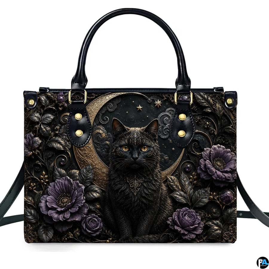 Direct front studio view showcasing the gothic black cat, golden crescent moon, and purple peonies on white surface.