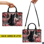 Side view highlighting dimensional relief black cat and floral artwork.