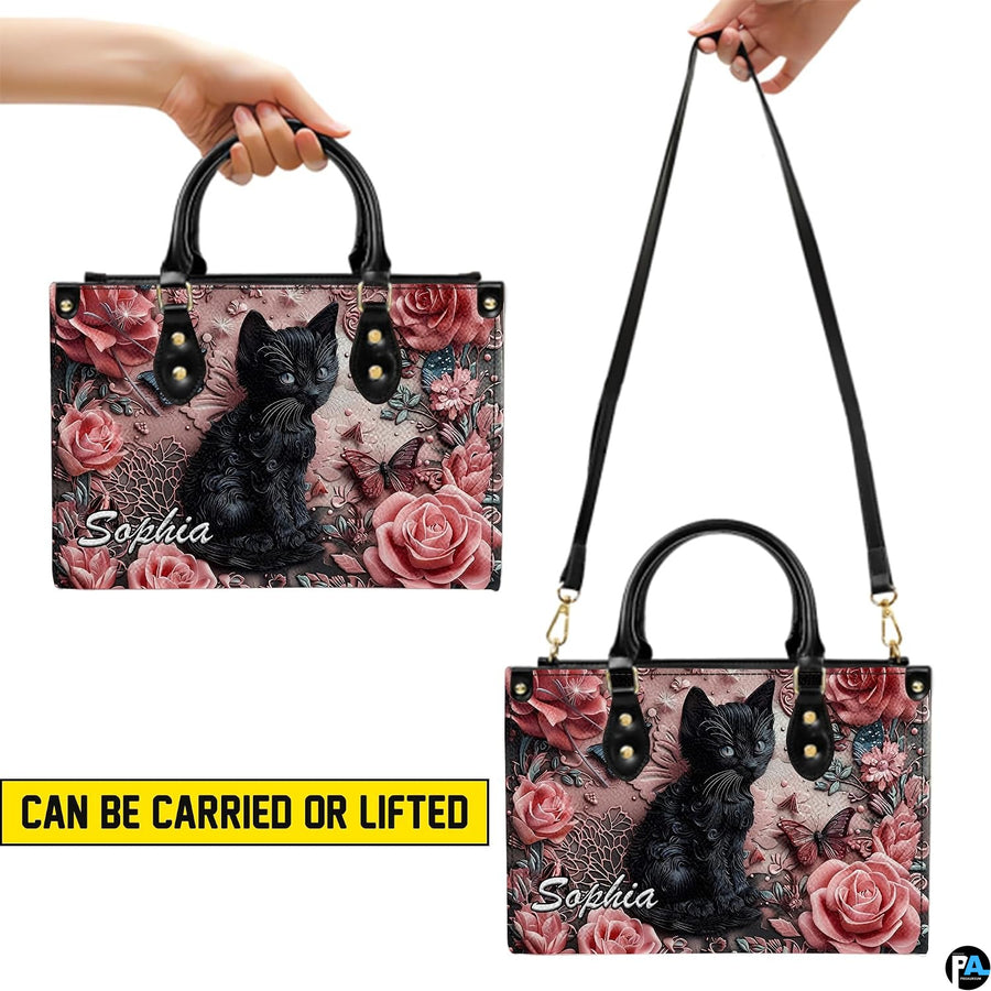 Side view highlighting dimensional relief black cat and floral artwork.