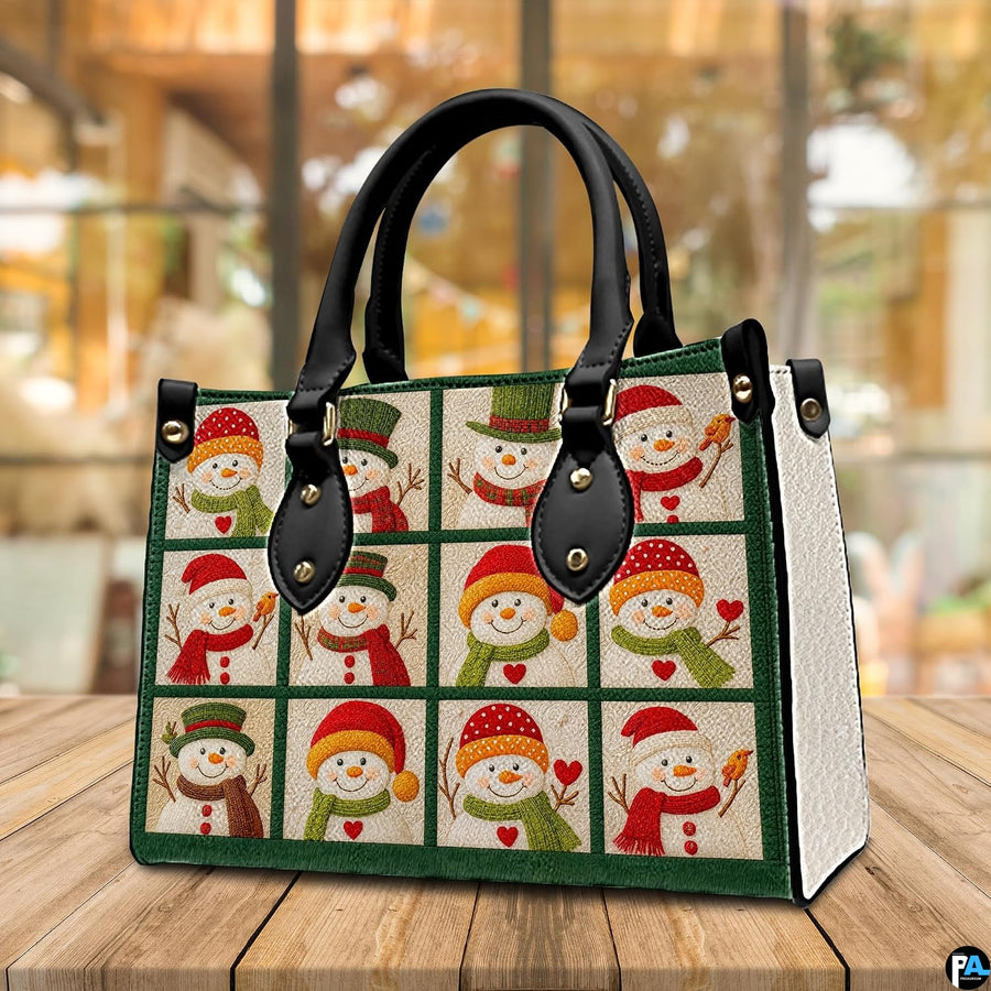 Lifestyle display of snowman patchwork handbag placed on a rustic wooden table in a brightly lit room.
