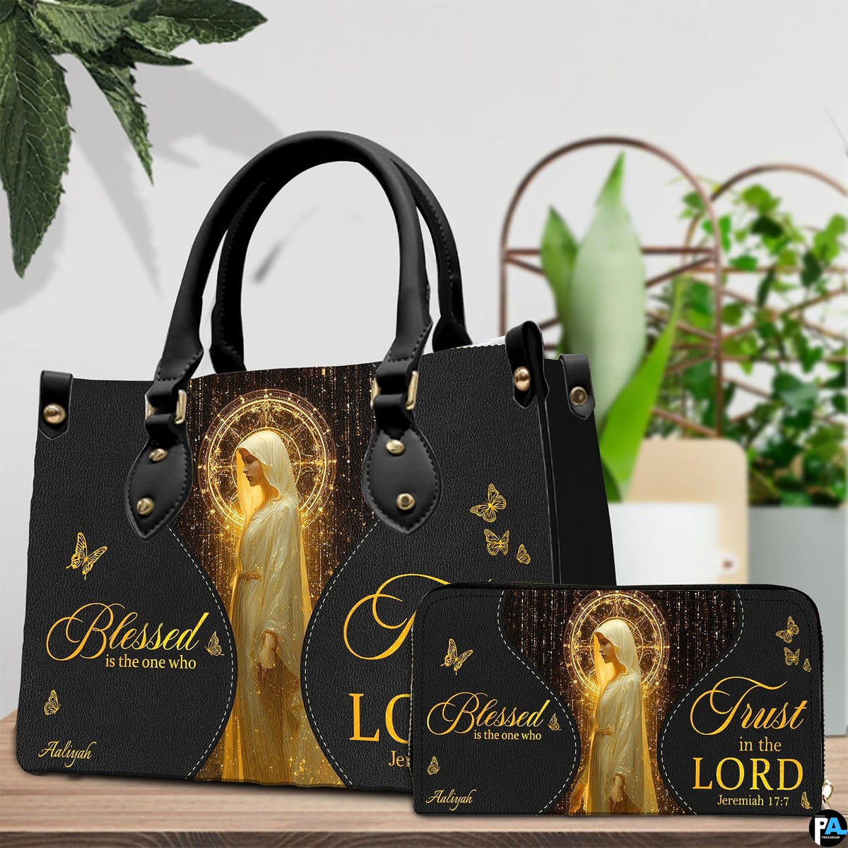 Side view of black holy figure handbag highlighting clean lines, depth, and structured shape.