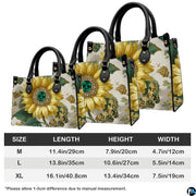 Coordinated jeweled sunflower handbag and matching wallet set on white surface