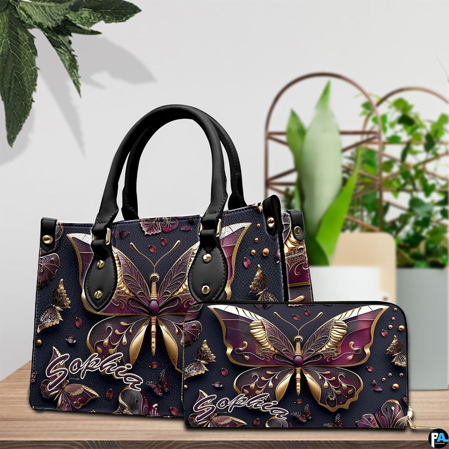 Close-up front view of handbag showing gold and plum butterfly wings