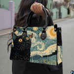 Starry night black cat painting held outdoors along a sunny sidewalk pathway.