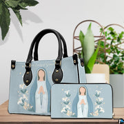 Minimalist Virgin Mary handbag and matching wallet styled together on wooden tabletop