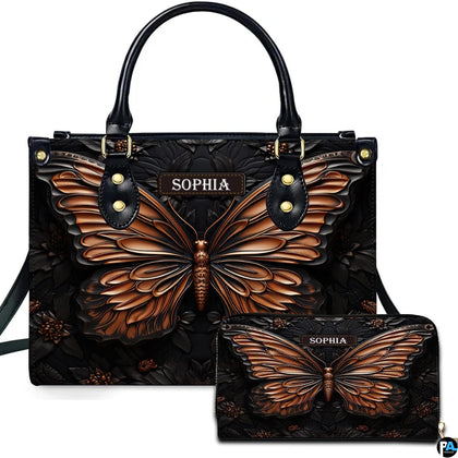 Sculpted copper butterfly handbag and matching wallet set shown against a plain white studio background.