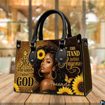 Melanin leopard faith print artwork resting on a polished wooden cafe surface in front of bright sunlit windows.