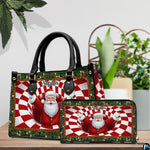 Handbag and matching zip wallet set displayed on a wooden surface beside decorative potted greenery.