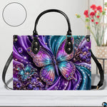 Close-up front view of matching zippered wallet showing crystal butterfly