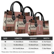 Angled perspective view of faith crystal cross handbag highlighting sparkling cross details.