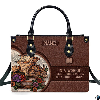 Front view of structured handbag featuring golden sleeping dragon, floral roses, and vintage printed book text