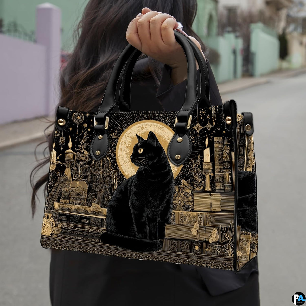 Black cat gothic art design showcased outdoors along a sunlit paved walkway.