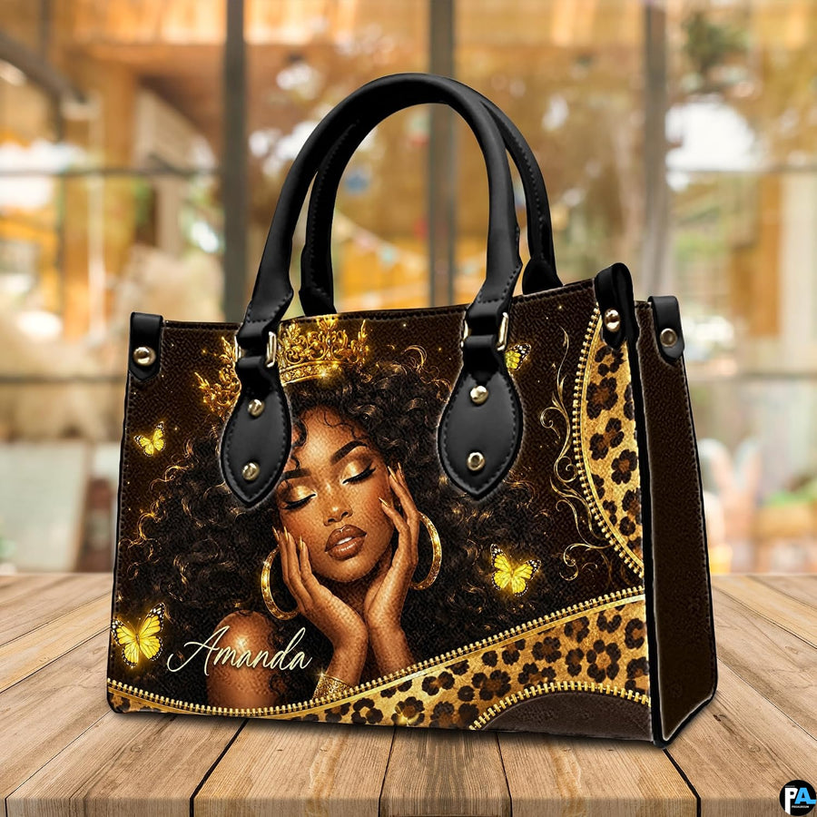 Regal queen portrait art print displayed on natural wood surface.