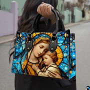 Handbag displayed outdoors in daylight showing rich sapphire blue stained glass.