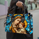 Handbag displayed outdoors in daylight showing rich sapphire blue stained glass.