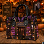 Tabletop view of purple crystal bookstore artwork surrounded by pumpkin lanterns and warm ambient lighting.