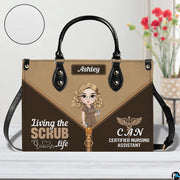 Chibi nursing assistant handbag displayed indoors alongside floral vase with circular texture swatch.