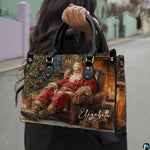 Matching wallet displaying festive sleeping Santa Claus fireside holiday artwork