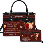 Front view of burgundy rose and hummingbird handbag and matching wallet with dual-tone black and red design.