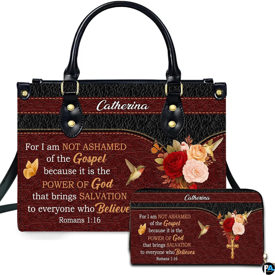 Front view of burgundy rose and hummingbird handbag and matching wallet with dual-tone black and red design.