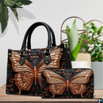 Top-handle handbag and matching wallet displayed together beside potted houseplants.