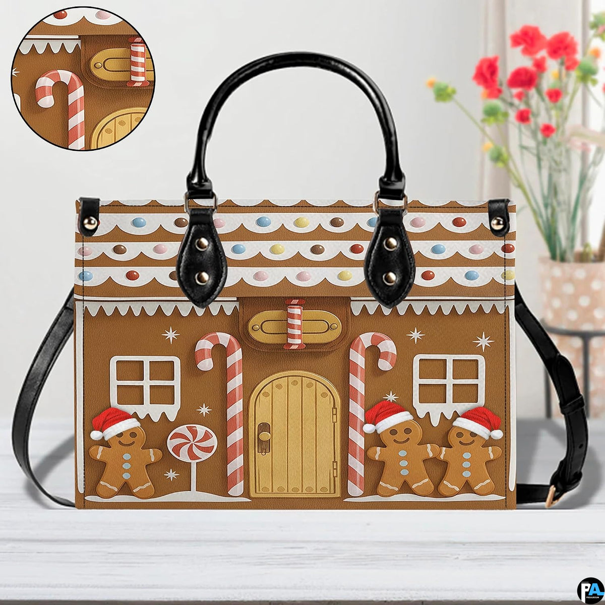 Front view of gingerbread cottage handbag on white surface next to floral decor with texture swatch.