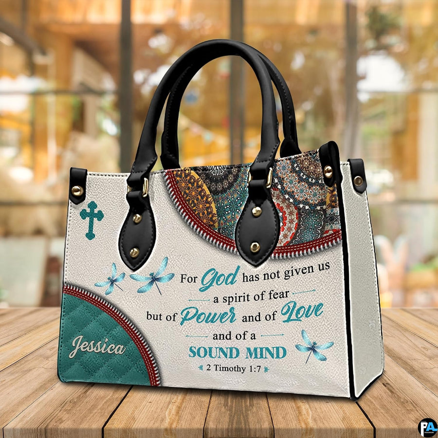 Scripture verse faith handbag arranged on tabletop in front of sunlit window.