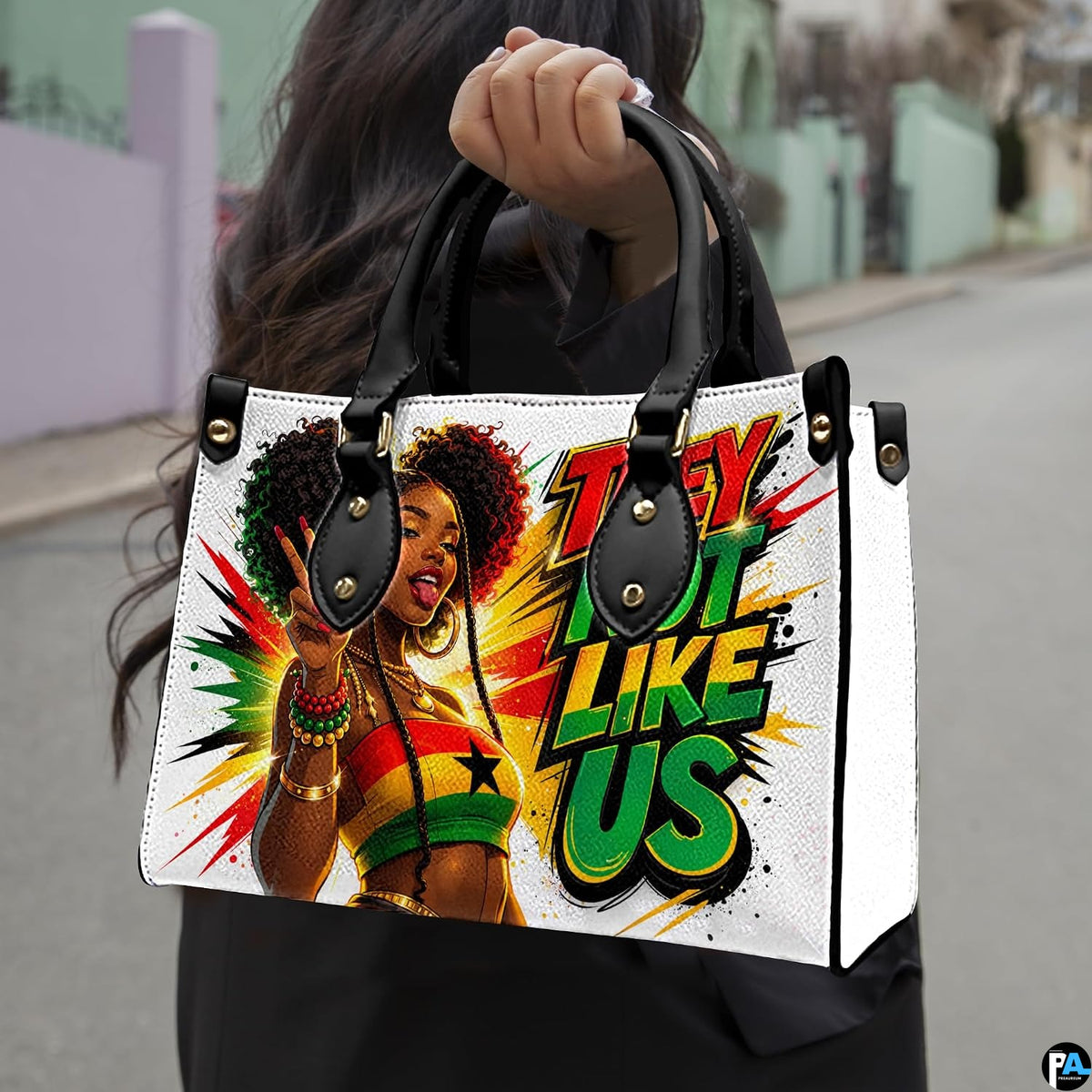 Woman carrying Afrocentric comic portrait handbag