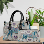 Coordinated arrangement of handbag and wallet displaying the matching filigree unicorn motif.