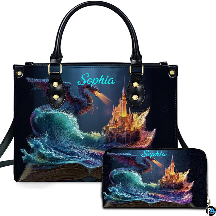 Storybook ocean wave and dragon castle artwork displayed across top-handle handbag and matching zip wallet.