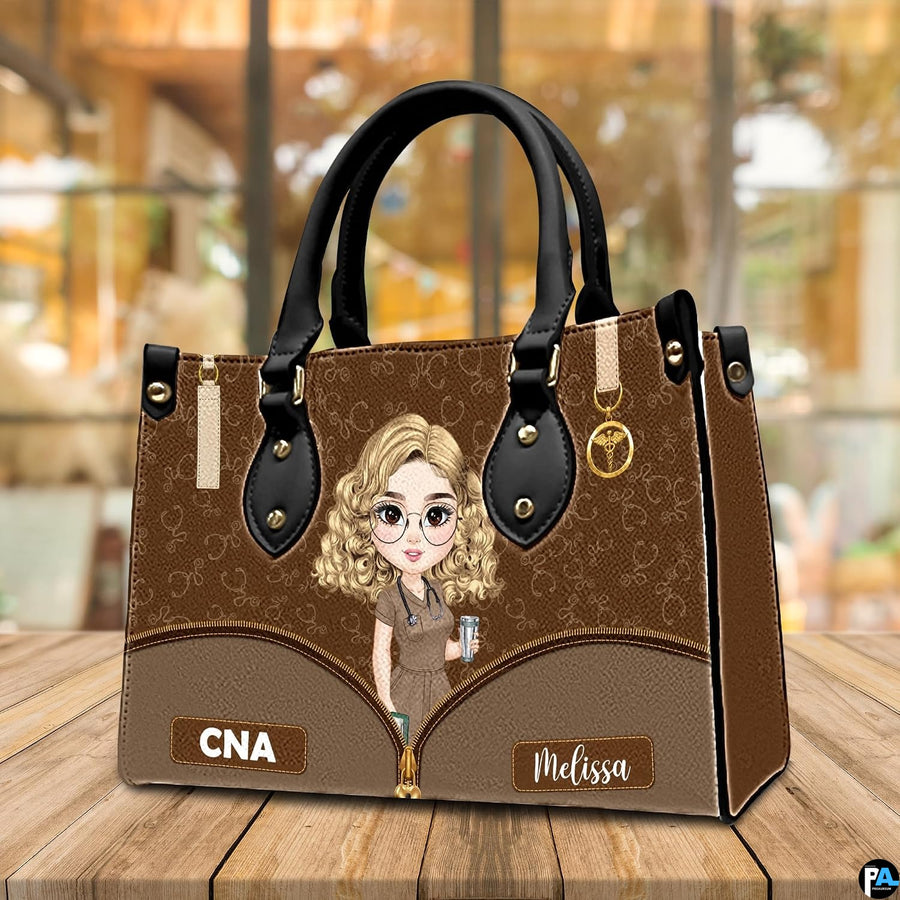 Chibi nursing assistant handbag shown on wooden tabletop with cafe background lighting.