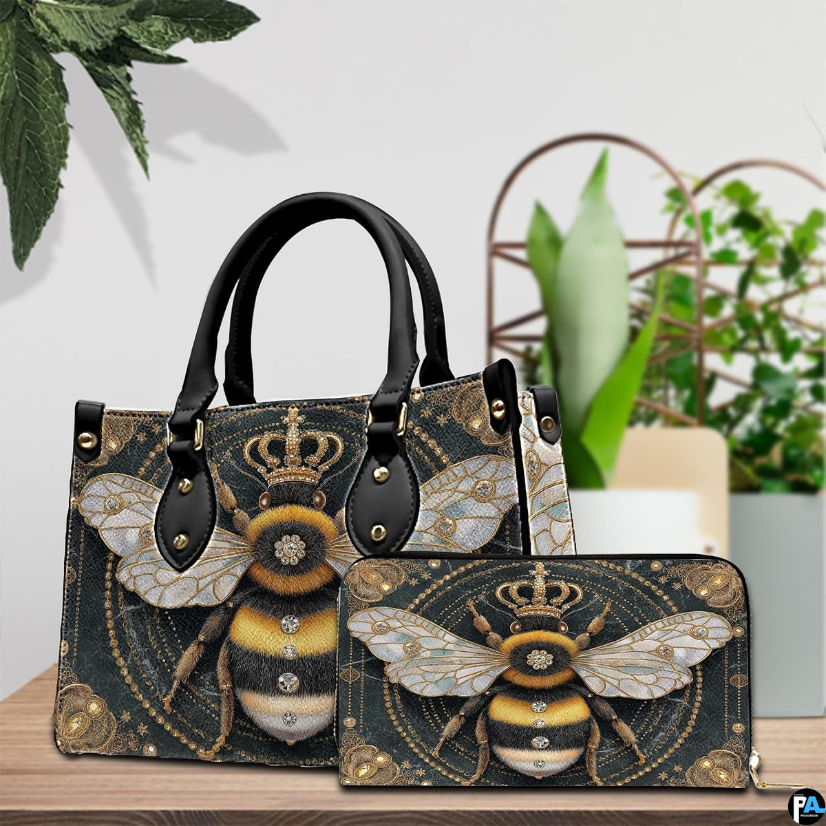 Coordinated arrangement of handbag and wallet displaying the matching bumblebee artwork.