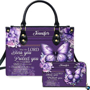 Front view of violet floral butterfly handbag and matching wallet with lavender hydrangea clusters.