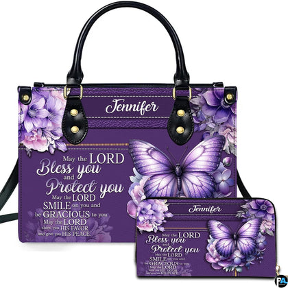 Front view of violet floral butterfly handbag and matching wallet with lavender hydrangea clusters.