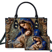 Virgin Mary and sleeping Christ child mosaic art on matching two-piece ensemble on white backdrop.
