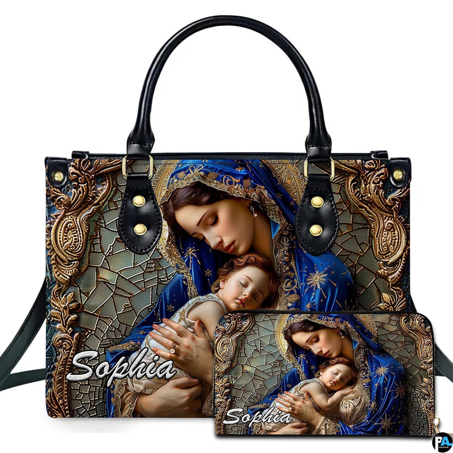 Virgin Mary and sleeping Christ child mosaic art on matching two-piece ensemble on white backdrop.