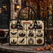 Outdoor perspective of the gothic flash satchel positioned on a rustic table before an ornate iron gate.