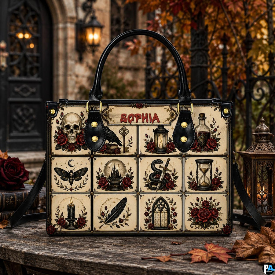 Outdoor perspective of the gothic flash satchel positioned on a rustic table before an ornate iron gate.
