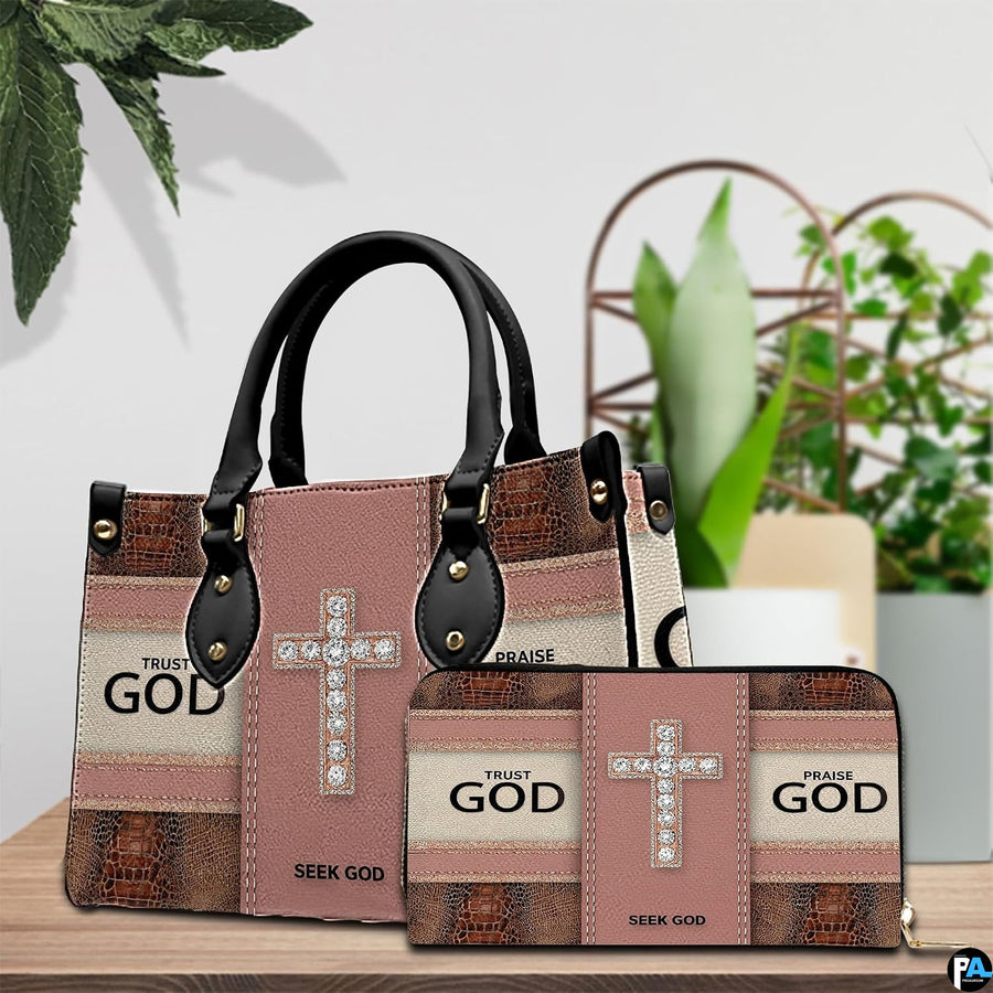 Detailed perspective of faith crystal cross handbag highlighting handle mounts and cross motif.