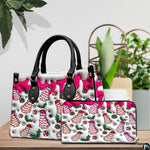 Holiday tree cake handbag and matching wallet resting on a wooden tabletop with plants.