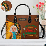 Chibi nurse cheetah print handbag shown on wooden tabletop with cafe background lighting.