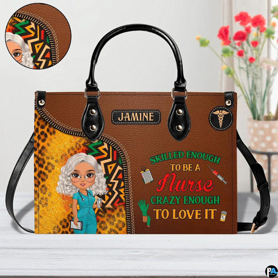 Chibi nurse cheetah print handbag shown on wooden tabletop with cafe background lighting.